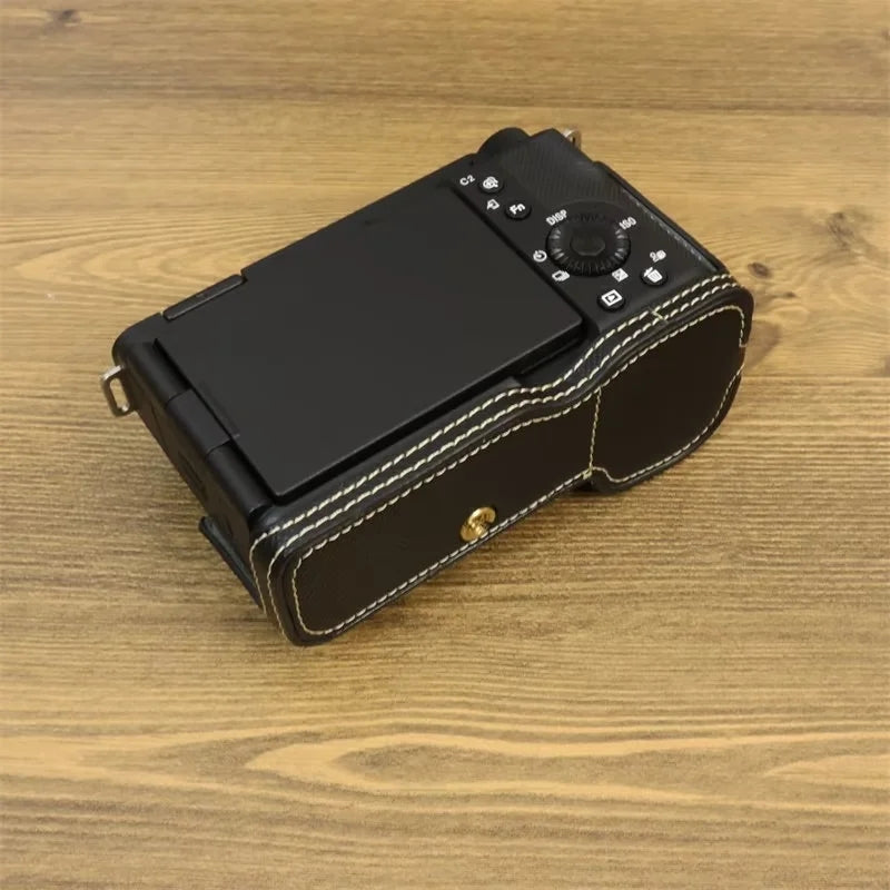 Uniqkart for Sony ZV-E1 Battery Opening Design PU Leather Camera Bottom Cover Half Body Case with Hand Strap - Black