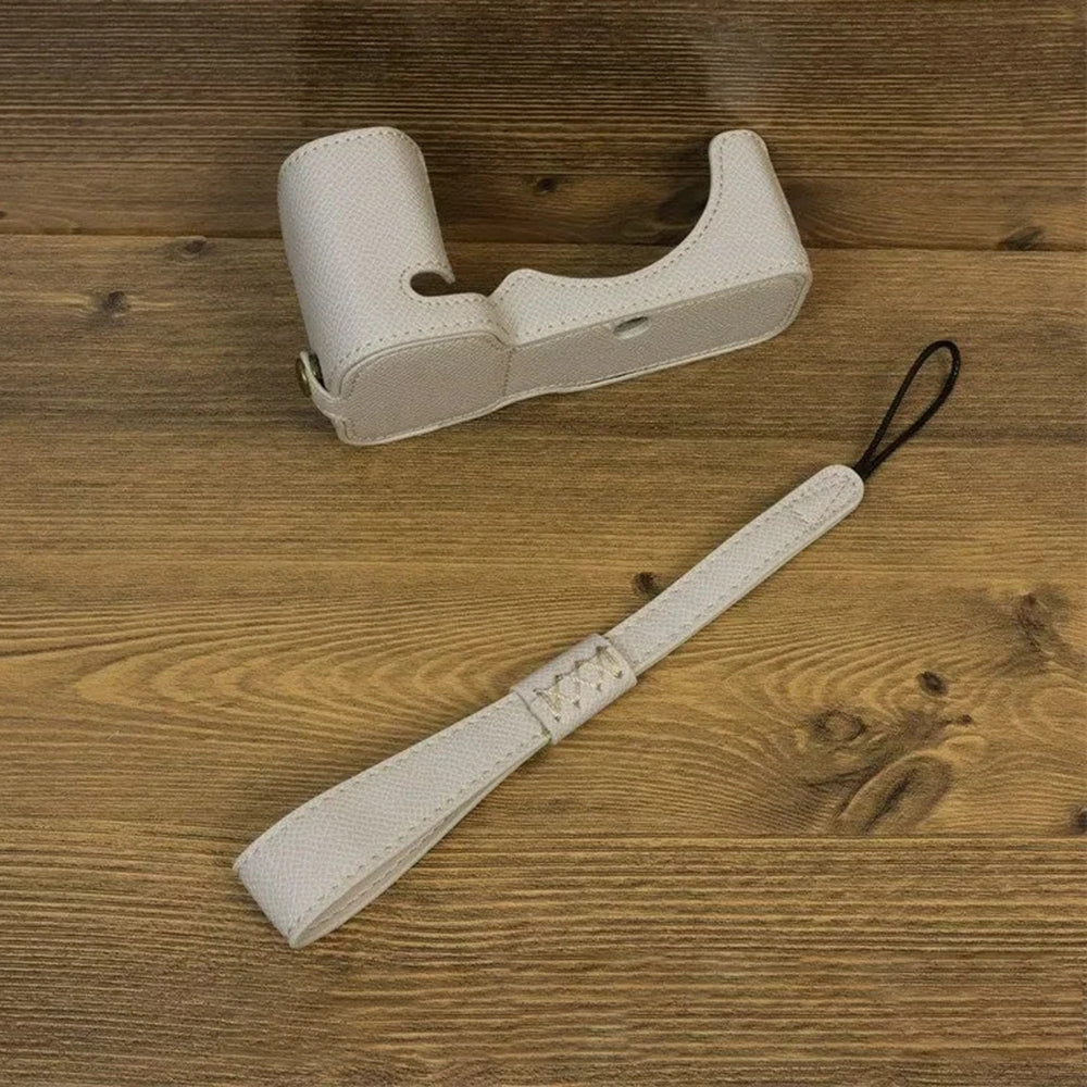 Uniqkart for Sony ZV-E1 Battery Opening Design PU Leather Camera Bottom Cover Half Body Case with Hand Strap - Grey White