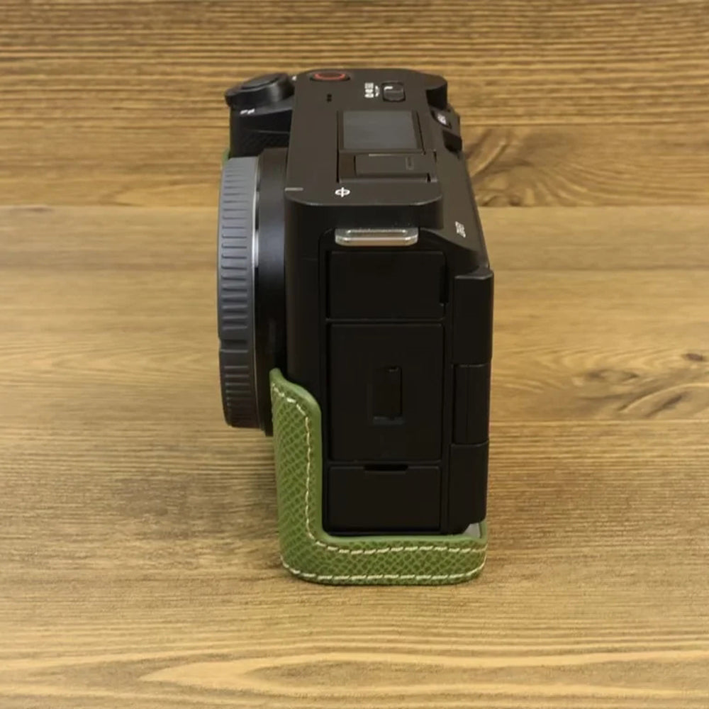 Uniqkart for Sony ZV-E1 Battery Opening Design PU Leather Camera Bottom Cover Half Body Case with Hand Strap - Green