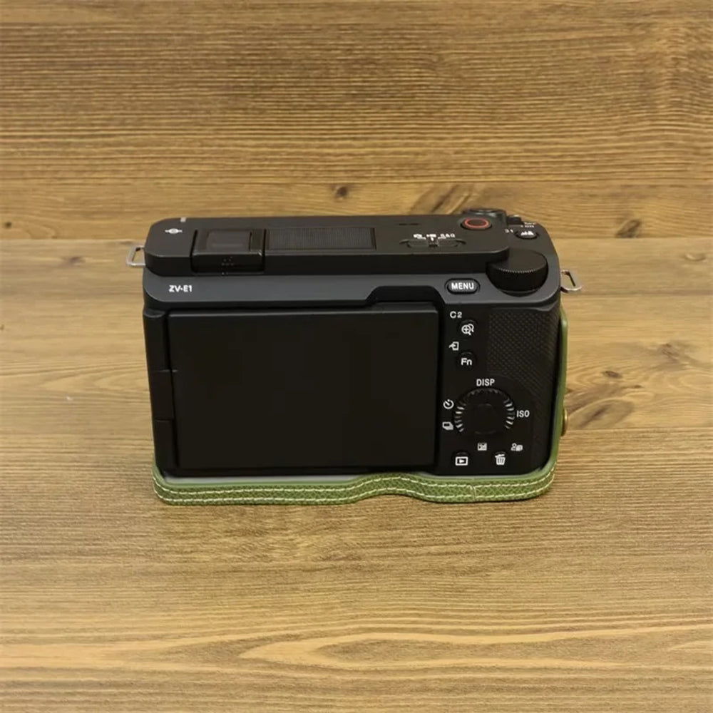 Uniqkart for Sony ZV-E1 Battery Opening Design PU Leather Camera Bottom Cover Half Body Case with Hand Strap - Green