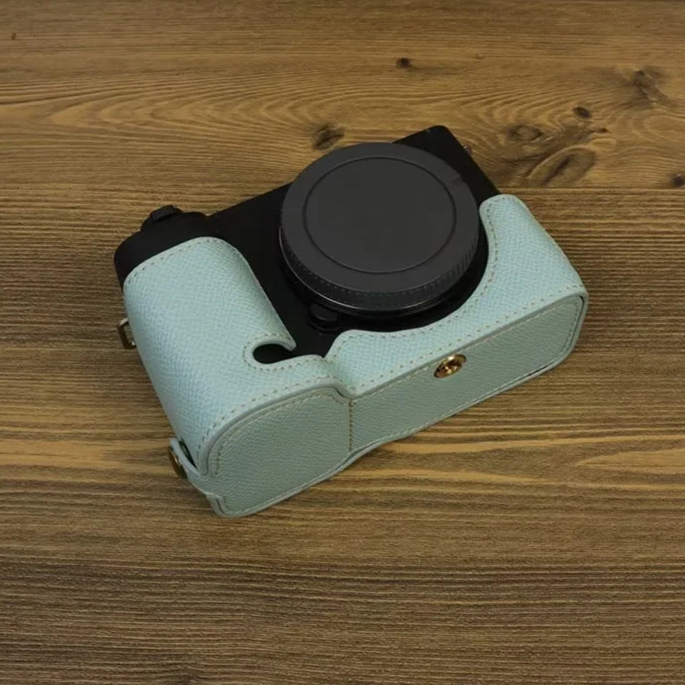 Uniqkart for Sony ZV-E1 Battery Opening Design PU Leather Camera Bottom Cover Half Body Case with Hand Strap - Baby Blue