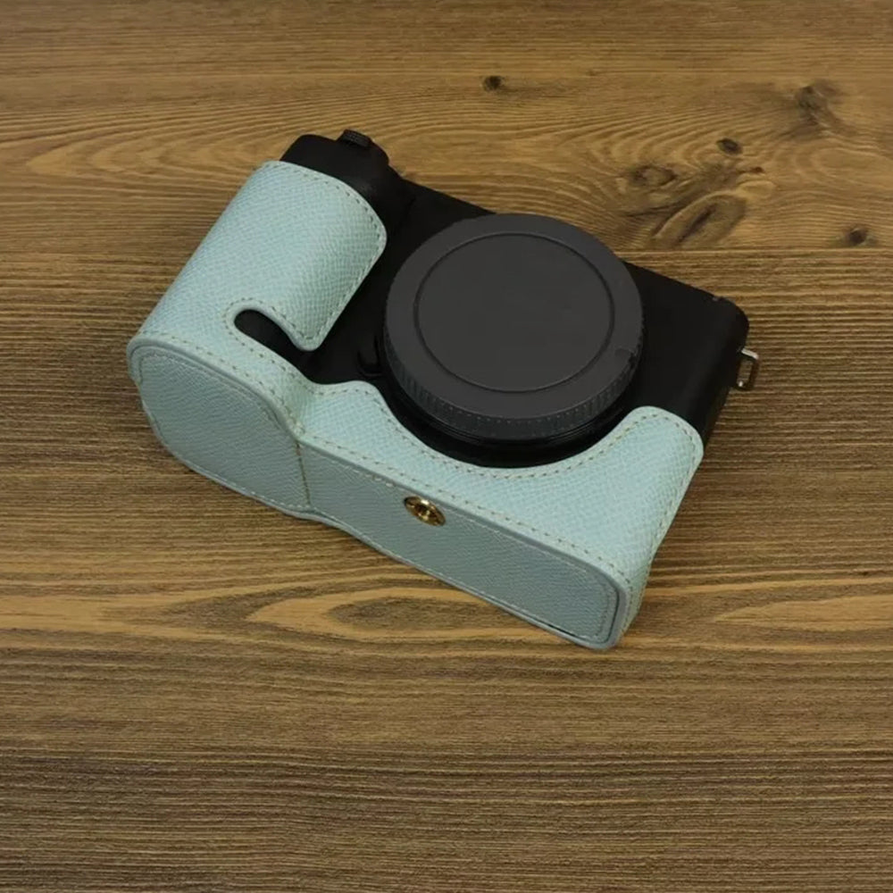 Uniqkart for Sony ZV-E1 Battery Opening Design PU Leather Camera Bottom Cover Half Body Case with Hand Strap - Baby Blue