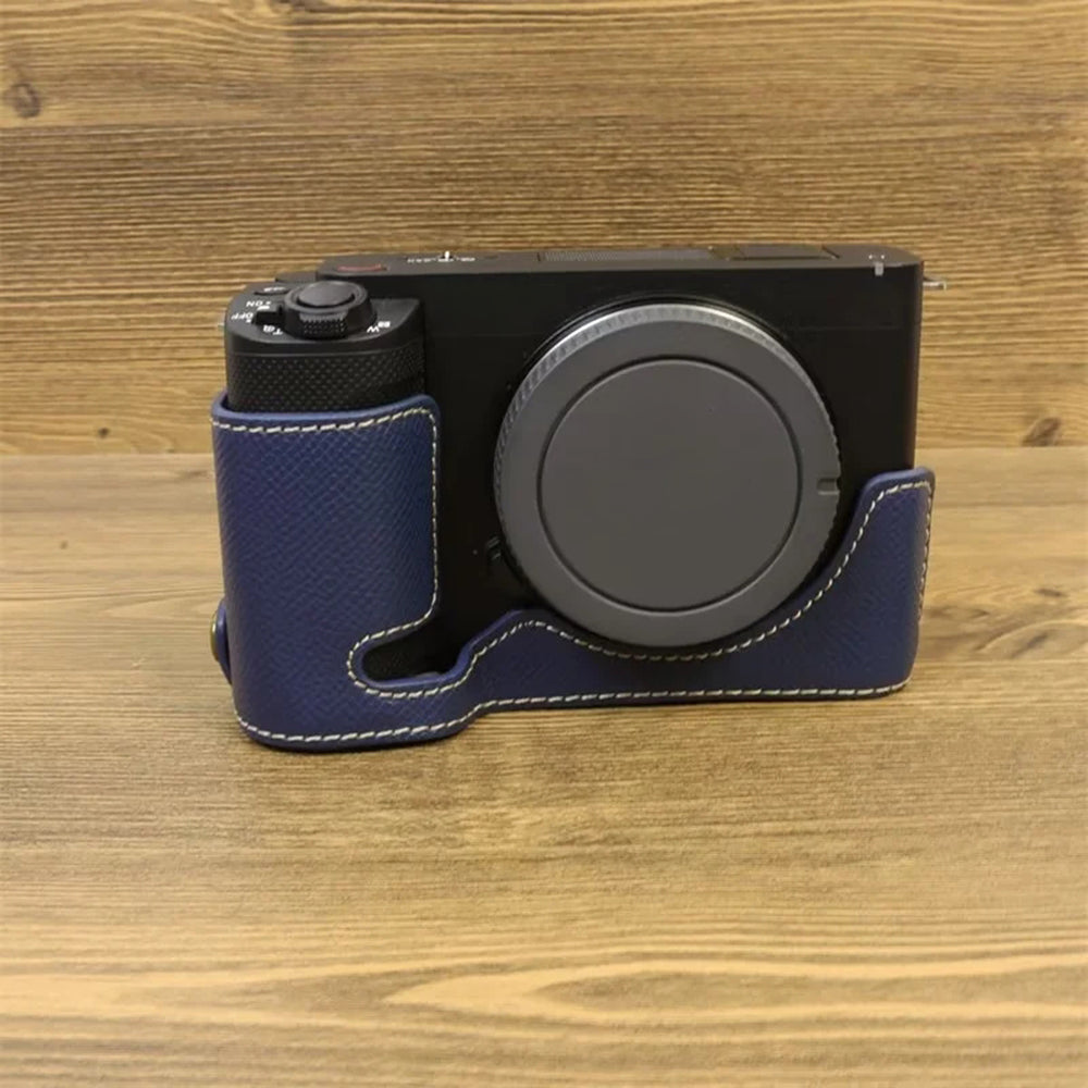 Uniqkart for Sony ZV-E1 Battery Opening Design PU Leather Camera Bottom Cover Half Body Case with Hand Strap - Dark Blue