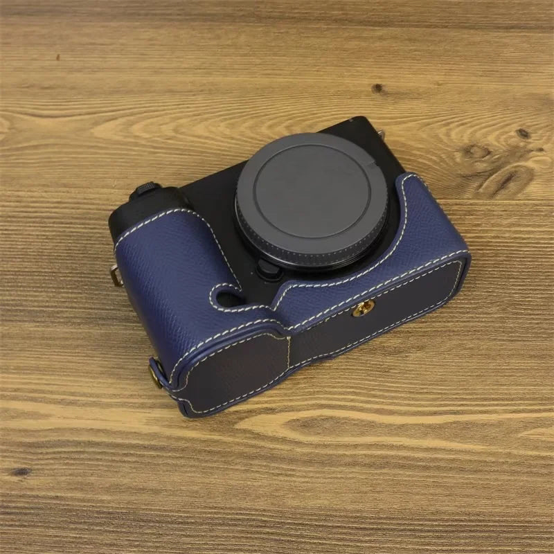 Uniqkart for Sony ZV-E1 Battery Opening Design PU Leather Camera Bottom Cover Half Body Case with Hand Strap - Dark Blue