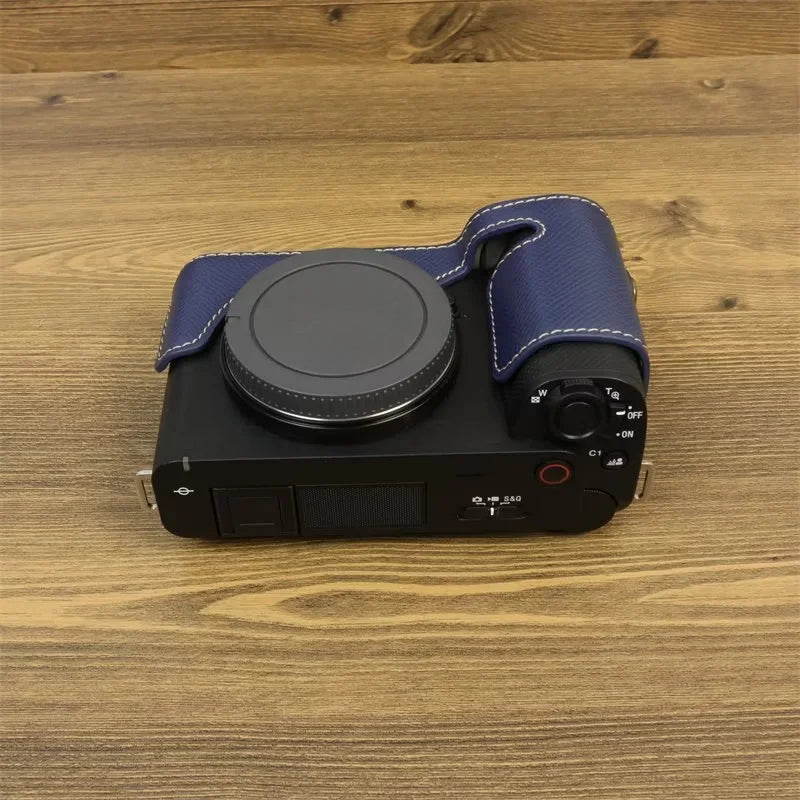 Uniqkart for Sony ZV-E1 Battery Opening Design PU Leather Camera Bottom Cover Half Body Case with Hand Strap - Dark Blue