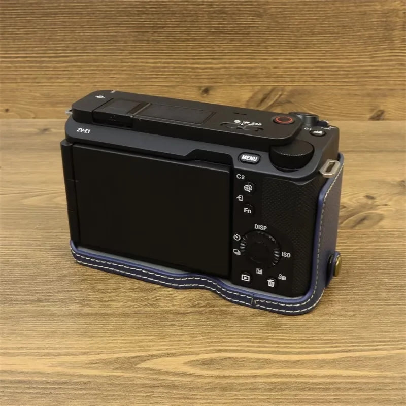 Uniqkart for Sony ZV-E1 Battery Opening Design PU Leather Camera Bottom Cover Half Body Case with Hand Strap - Dark Blue
