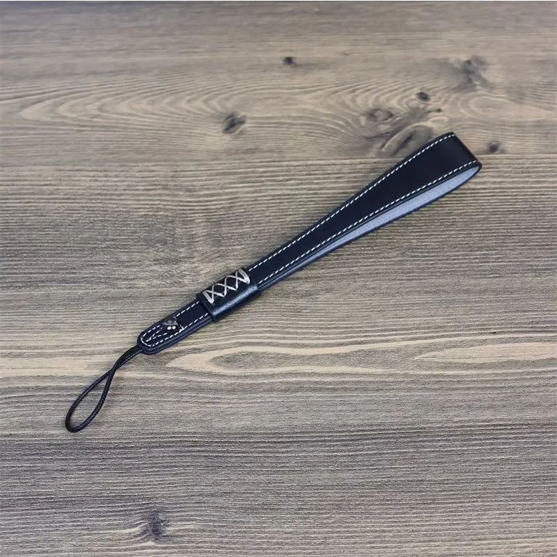 Uniqkart for Fuji / Canon / Nikon / Panasonic DSLR Camera 2mm Connector PU Leather Wrist Strap Hand Grip Rope - Black