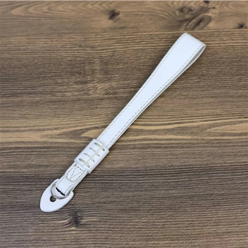 Uniqkart for Fujifilm xt5 / xh2 / xt4 / xs10 / xt30II Camera PU Leather Hand Strap SLR Camera Anti-lost Wrist Rope - White