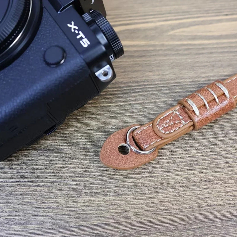 Uniqkart for Fujifilm xt5 / xh2 / xt4 / xs10 / xt30II Camera PU Leather Hand Strap SLR Camera Anti-lost Wrist Rope - Brown