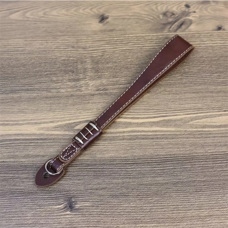 Uniqkart for Fujifilm xt5 / xh2 / xt4 / xs10 / xt30II Camera PU Leather Hand Strap SLR Camera Anti-lost Wrist Rope - Coffee