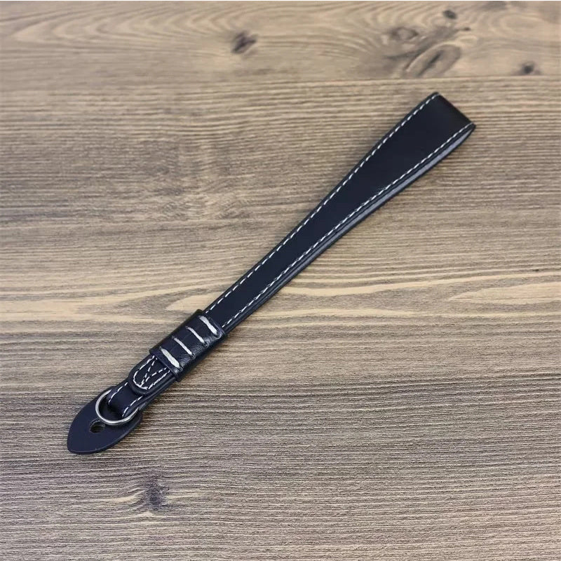 Uniqkart for Fujifilm xt5 / xh2 / xt4 / xs10 / xt30II Camera PU Leather Hand Strap SLR Camera Anti-lost Wrist Rope - Black