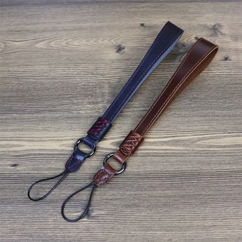 Uniqkart for Fujifilm XT4 / A7r5 / A7M4 / X100v / XH2 Camera Carrying Strap Top Layer Cowhide Leather Quick Release Hand Rope - Black