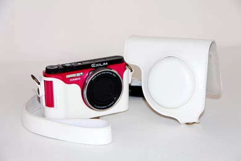 Protective Leather Camera Cover Casing with Shoulder Strap for Casio ZR1000/1200/1100/1500 - White