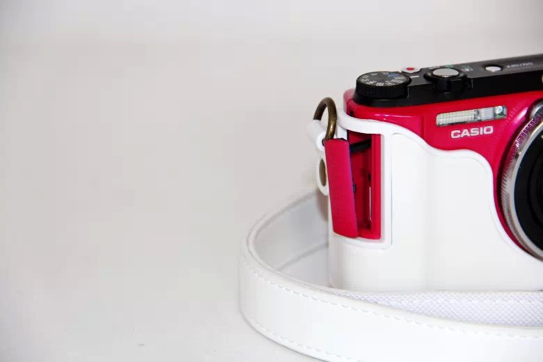 Protective Leather Camera Cover Casing with Shoulder Strap for Casio ZR1000/1200/1100/1500 - White