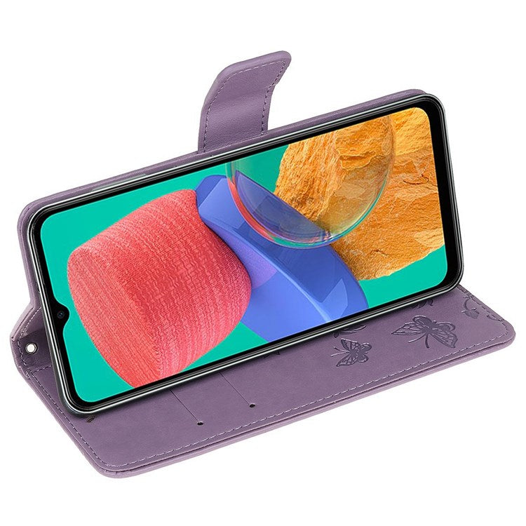 For Samsung Galaxy M33 5G (India Version) PU Leather Magnetic Flip Cover Butterfly Flower Imprinted Stand Hand Strap Wallet Purse Case - Purple