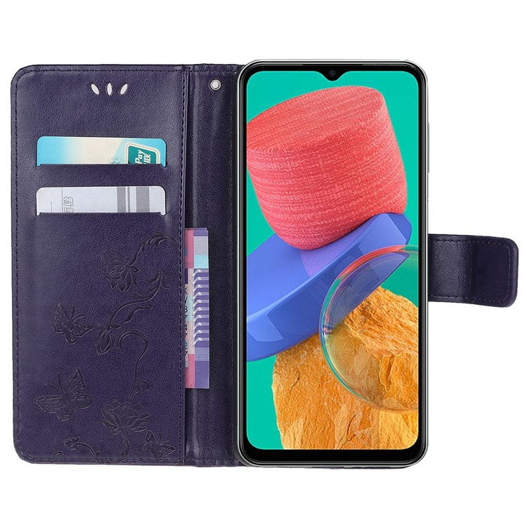 For Samsung Galaxy M33 5G (India Version) PU Leather Magnetic Flip Cover Butterfly Flower Imprinted Stand Hand Strap Wallet Purse Case - Dark Blue
