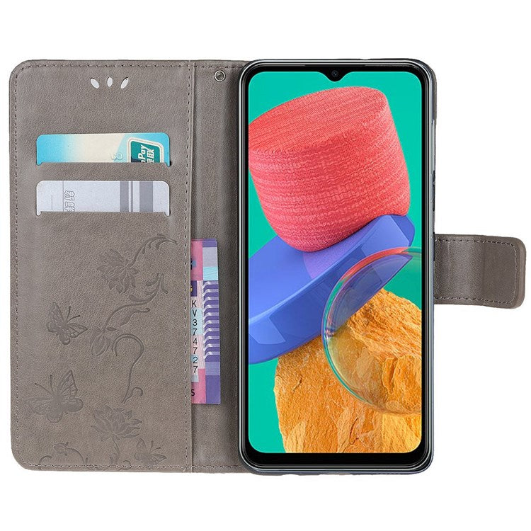 For Samsung Galaxy M33 5G (India Version) PU Leather Magnetic Flip Cover Butterfly Flower Imprinted Stand Hand Strap Wallet Purse Case - Grey