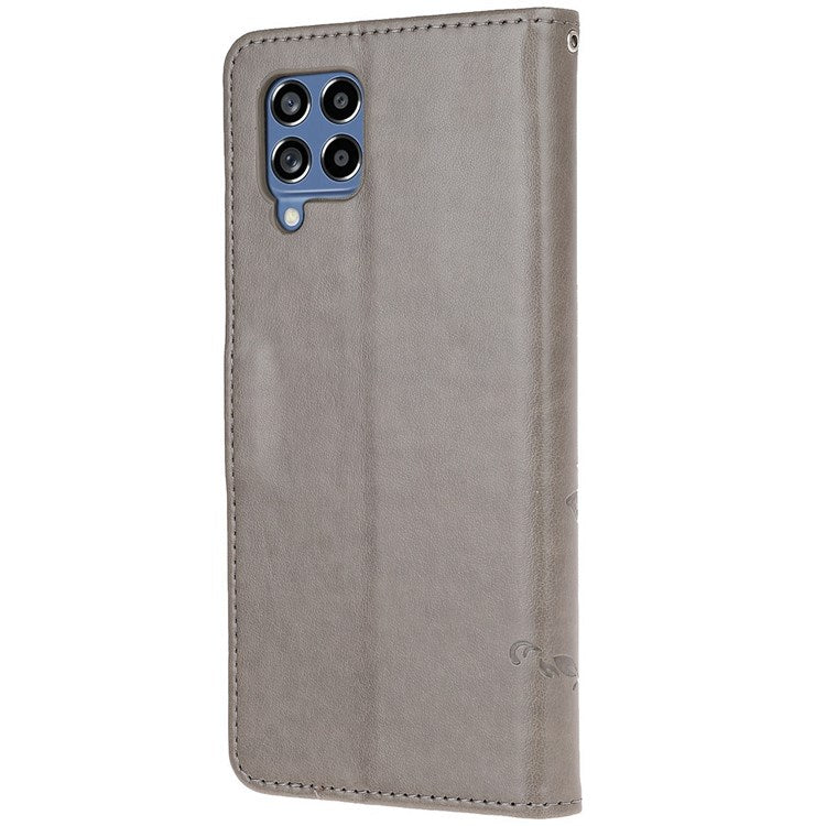 For Samsung Galaxy M33 5G (India Version) PU Leather Magnetic Flip Cover Butterfly Flower Imprinted Stand Hand Strap Wallet Purse Case - Grey