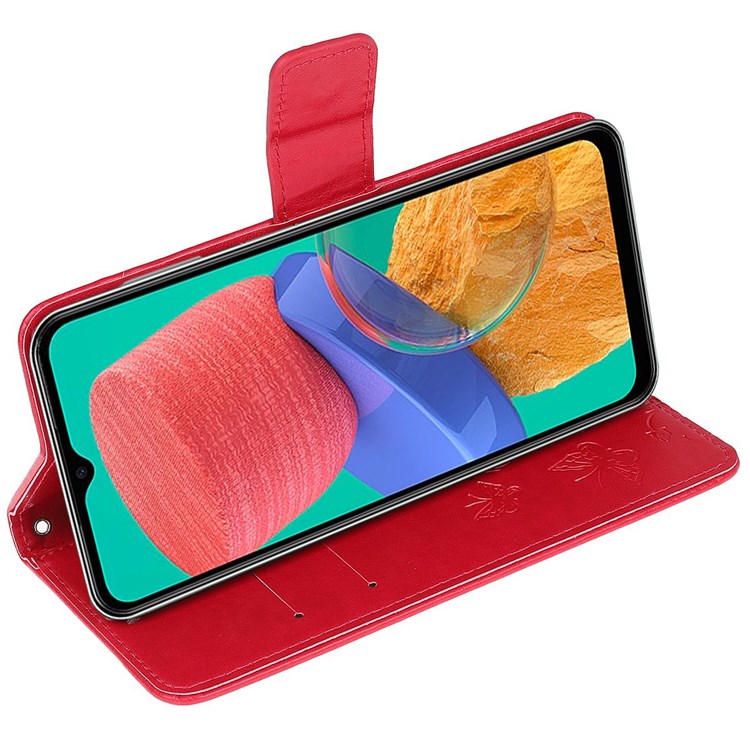 For Samsung Galaxy M33 5G (India Version) PU Leather Magnetic Flip Cover Butterfly Flower Imprinted Stand Hand Strap Wallet Purse Case - Red