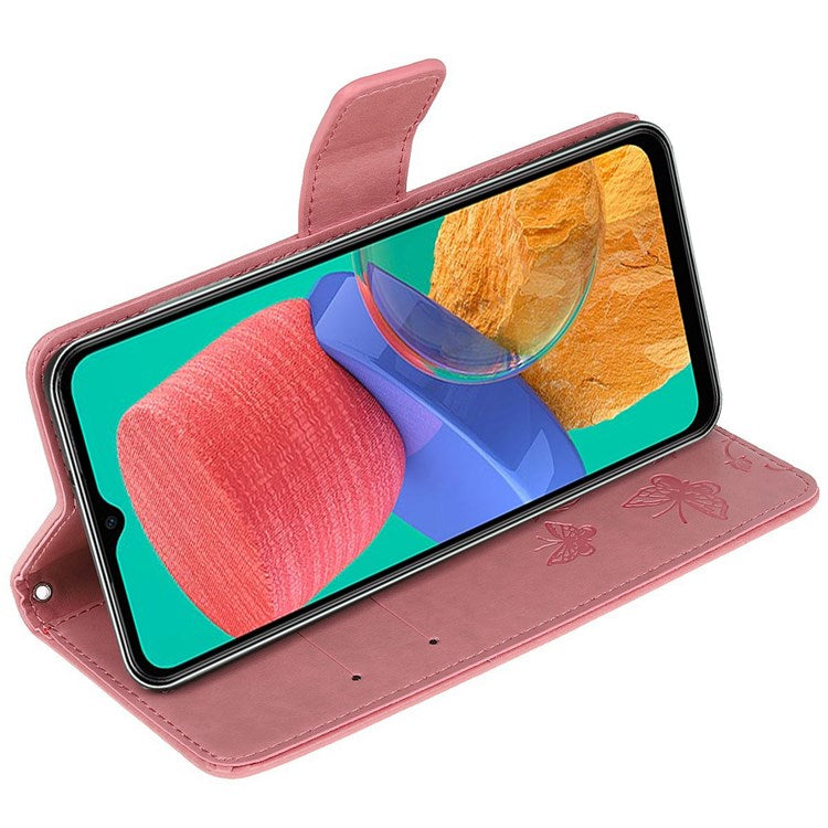 For Samsung Galaxy M33 5G (India Version) PU Leather Magnetic Flip Cover Butterfly Flower Imprinted Stand Hand Strap Wallet Purse Case - Pink