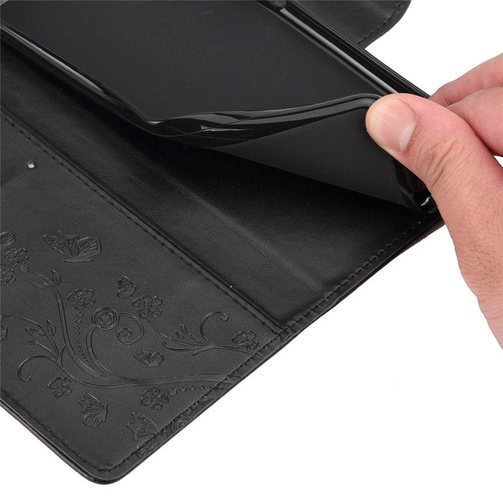 For Samsung Galaxy M33 5G (Global Version) Butterfly Flower Imprinted Wallet Case, PU Leather Foldable Stand Flip Cover with Hand Strap - Black