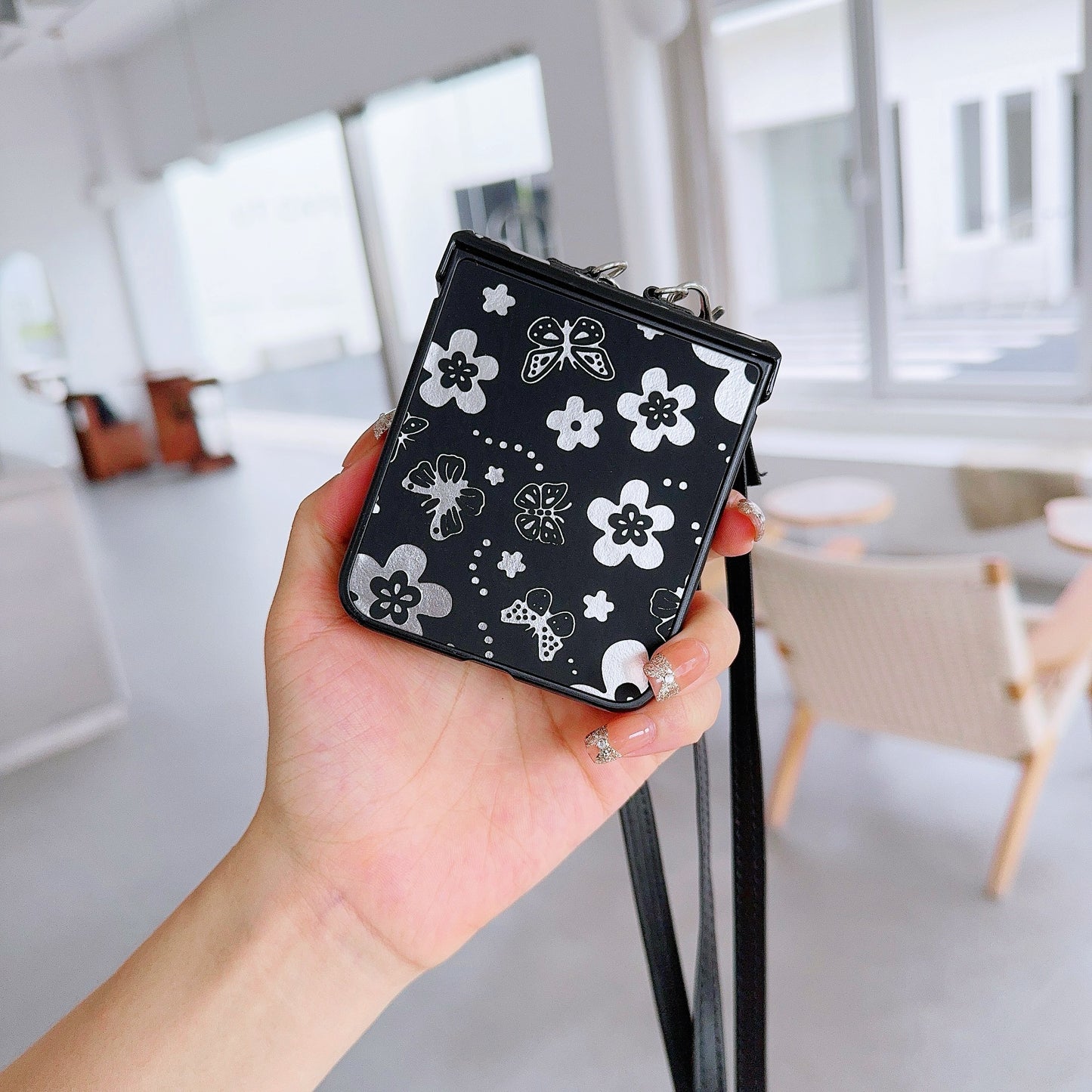 For Samsung Galaxy Z Flip6 5G Butterfly and Flower Pattern PU Leather Coated PC Phone Cover with Crossbody Strap - Black