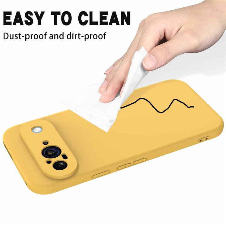 For Google Pixel 9 Case Liquid Silicone Shockproof Phone Cover with Hand Strap - Yellow