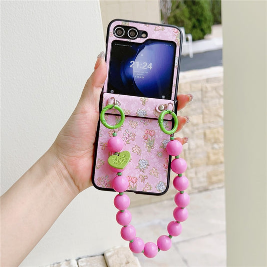 For Samsung Galaxy Z Flip7 FE 5G / Z Flip6 5G Case Anti Drop PC + PU Phone Back Cover with Beaded Strap Pattern Design - Tulip Pink