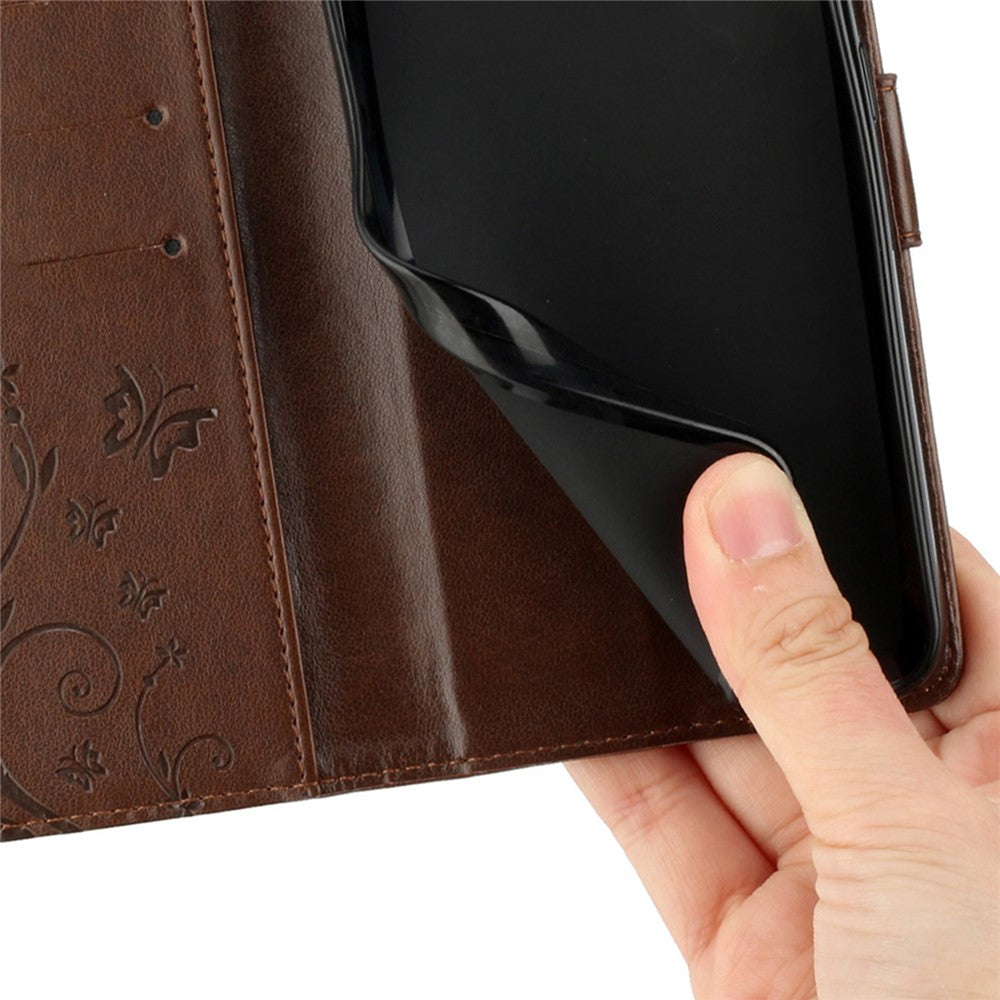 For iPhone 17 Pro Max Leather Wallet Case Butterfly Flower Imprinted Phone Cover with Strap - Brown