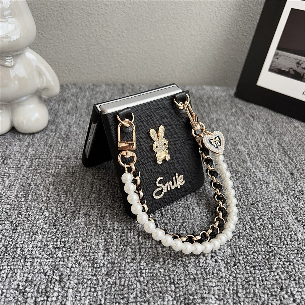 For Samsung Galaxy Z Flip7 5G Case Smile Rabbit PU + PC Phone Cover with Wrist Strap - Cross Texture