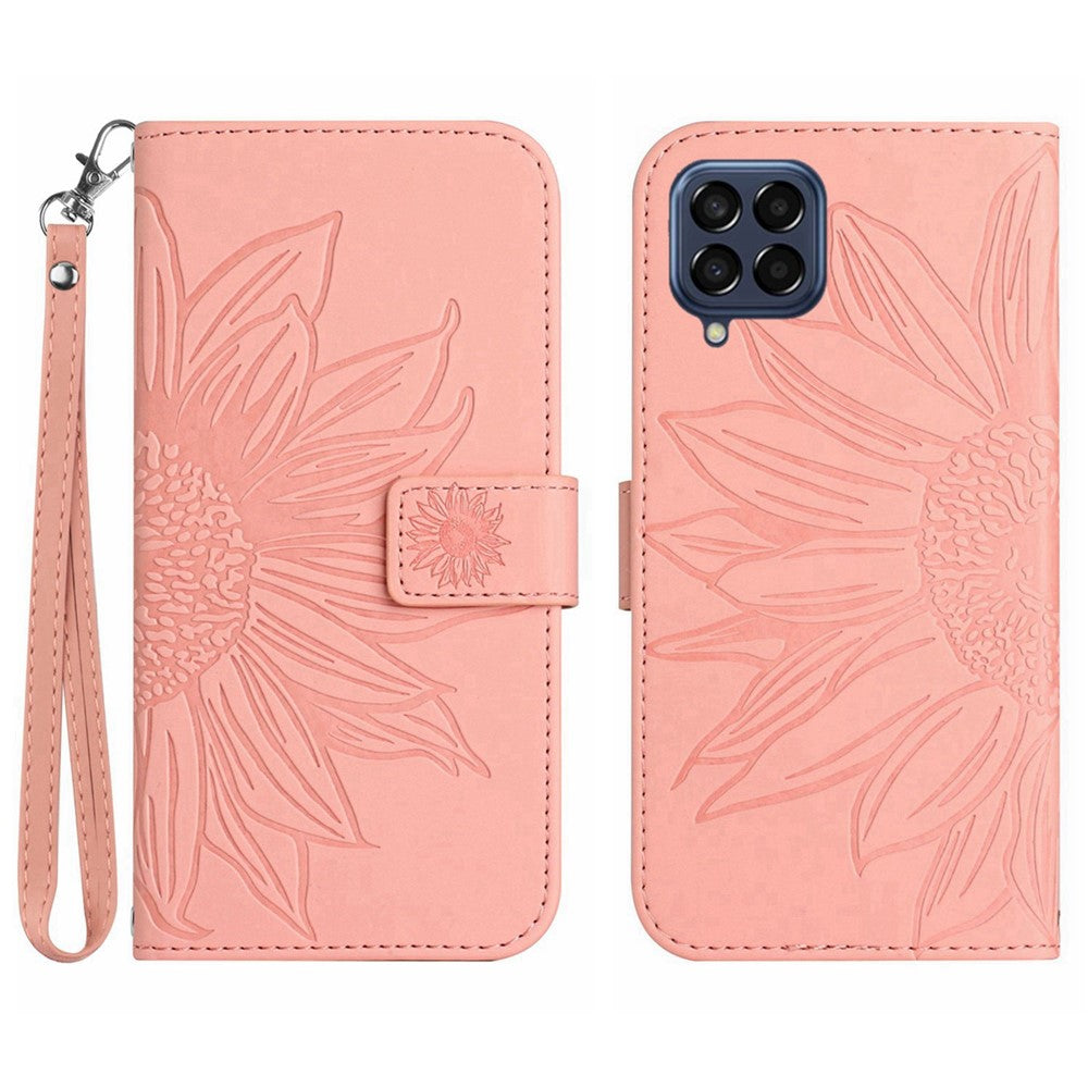 For Samsung Galaxy M33 5G (Global Version) HT04 Skin-Touch PU Leather Phone Shockproof Case Imprinted Sunflower Flip Stand Wallet Cover with Hand Strap - Light Pink