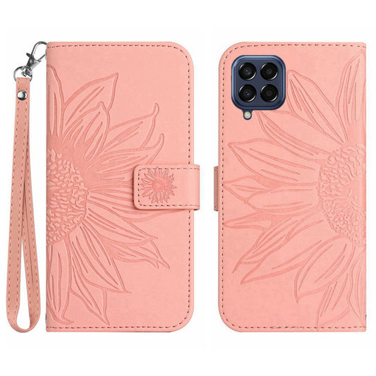 For Samsung Galaxy M33 5G (Global Version) HT04 Skin-Touch PU Leather Phone Shockproof Case Imprinted Sunflower Flip Stand Wallet Cover with Hand Strap - Light Pink