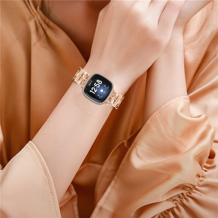 For Fitbit Versa 4 / Sense 2 Zinc Alloy Strap Rhinestones Decor Crown X-shape Smartwatch Band - Rose Gold