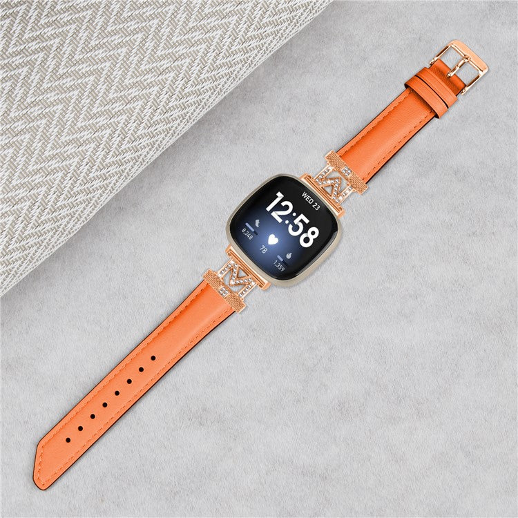 M Shape Rhinestone Watchband for Fitbit Versa 3 / Versa 4 / Sense / Sense 2 Genuine Cowhide Leather Watch Strap with Rose Gold Buckle - Orange