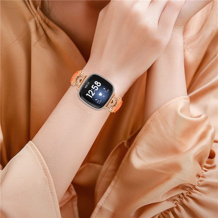 M Shape Rhinestone Watchband for Fitbit Versa 3 / Versa 4 / Sense / Sense 2 Genuine Cowhide Leather Watch Strap with Rose Gold Buckle - Orange