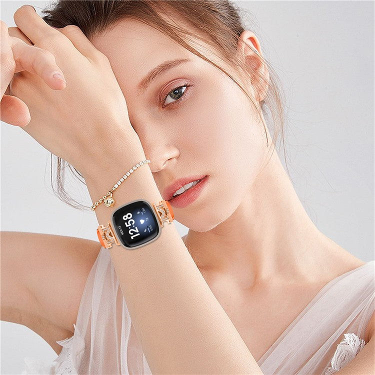 M Shape Rhinestone Watchband for Fitbit Versa 3 / Versa 4 / Sense / Sense 2 Genuine Cowhide Leather Watch Strap with Rose Gold Buckle - Orange