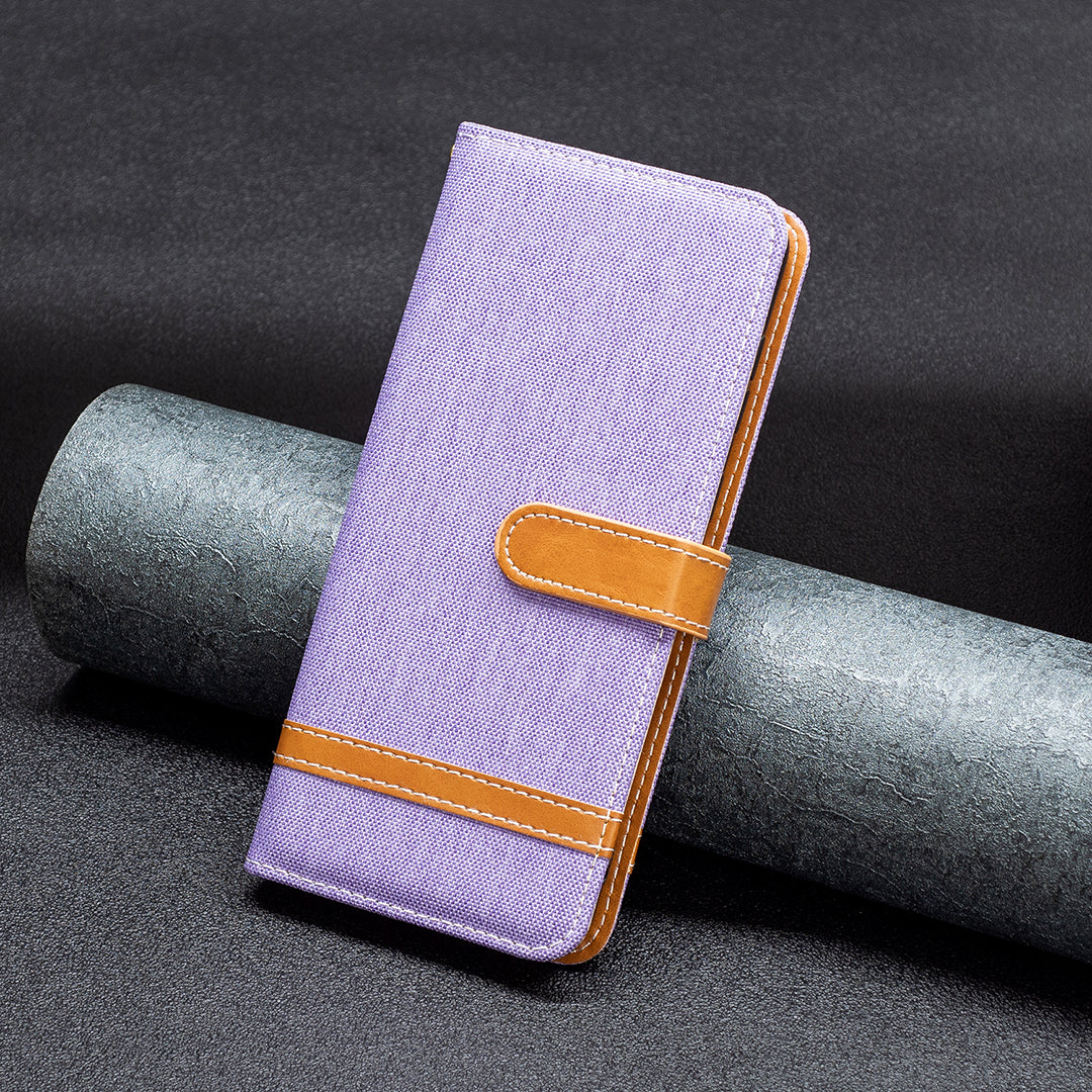 Uniqkart for iPhone 15 Jeans Cloth Splicing PU Leather + TPU Phone Case Wallet Stand Anti-scratch Cover - Purple