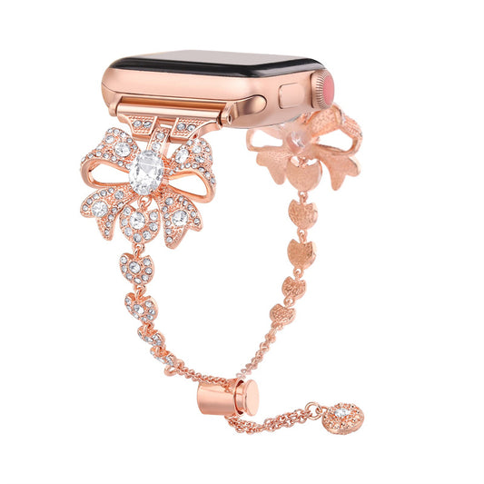 for Apple Watch Series 8 / 7 41mm / 6 / 5 / 4 / SE / SE (2022) 40mm / 3 / 2 / 1 38mm Rhinestones Decor Bowknot Bracelet Metal Watch Strap Adjustable Wrist Band - Rose Gold