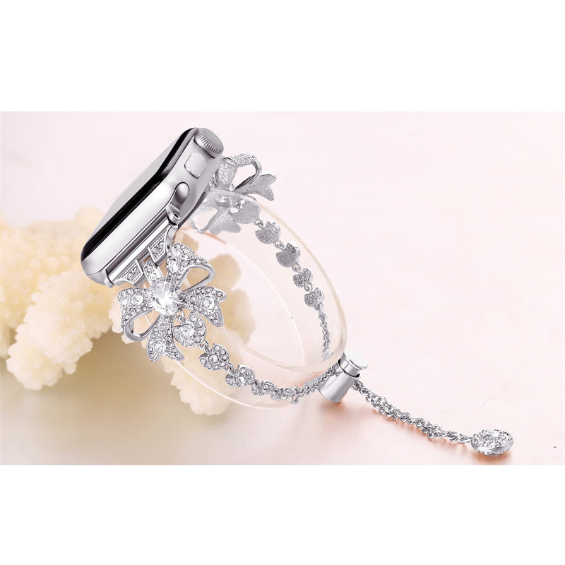 for Apple Watch Series 8 / 7 41mm / 6 / 5 / 4 / SE / SE (2022) 40mm / 3 / 2 / 1 38mm Rhinestones Decor Bowknot Bracelet Metal Watch Strap Adjustable Wrist Band - Silver