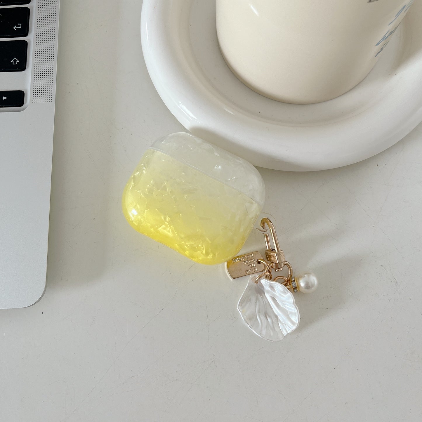 Uniqkart for AirPods Pro 2 Gradient Shell Grain TPU Case Shockproof Earphone Cover with Shell Shape Pendant - Yellow