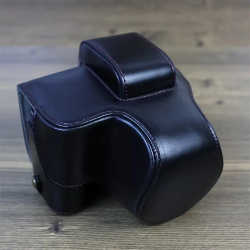 PU Leather Camera Case Bag for Canon EOS R10, Battery Opening Design Protective Cover with Lens Pouch and Strap - Black