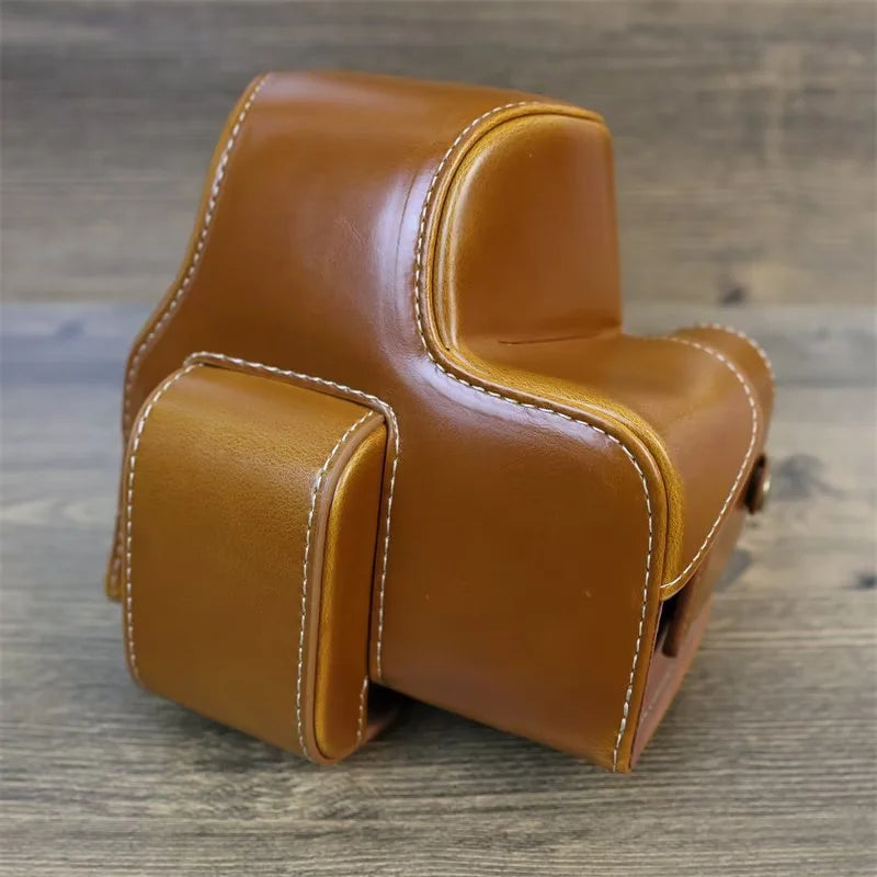 PU Leather Camera Case Bag for Canon EOS R10, Battery Opening Design Protective Cover with Lens Pouch and Strap - Brown