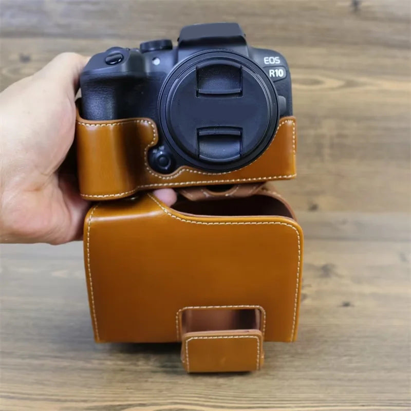 PU Leather Camera Case Bag for Canon EOS R10, Battery Opening Design Protective Cover with Lens Pouch and Strap - Brown