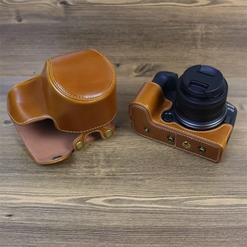 PU Leather Camera Case Bag for Canon EOS R10, Battery Opening Design Protective Cover with Lens Pouch and Strap - Brown