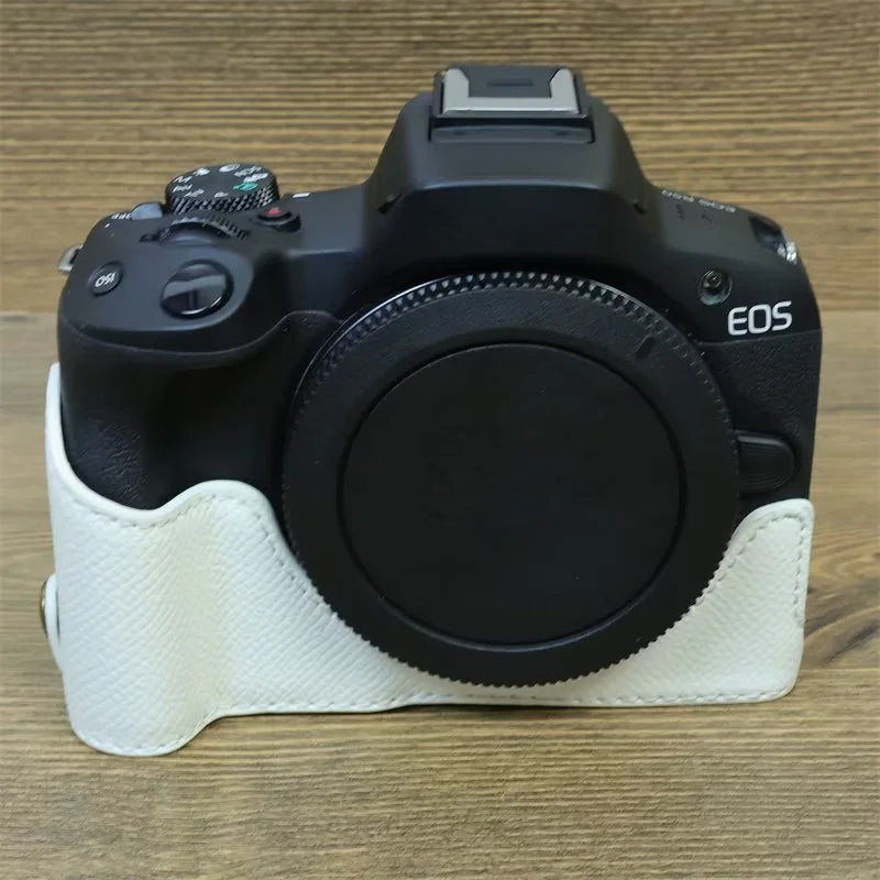 Uniqkart for Canon EOS R50 Anti-Shock PU Leather Camera Bottom Cover Large Opening Design Half Body Case with Strap - White