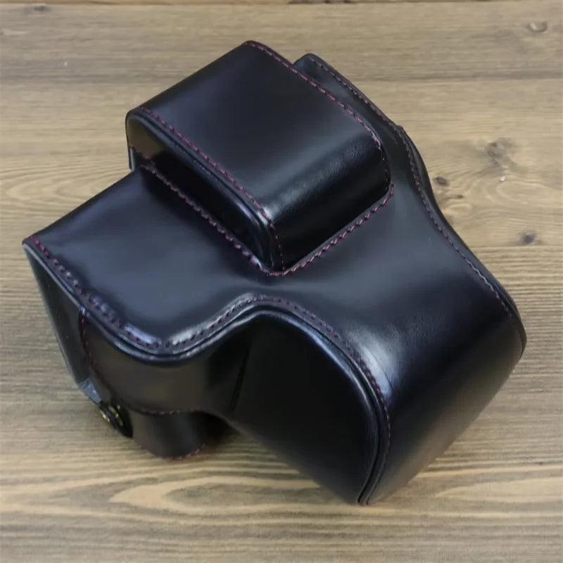 Uniqkart for Canon EOS R50 PU Leather Camera Case Battery Opening Design Camera Cover with Strap and Small Bag - Black
