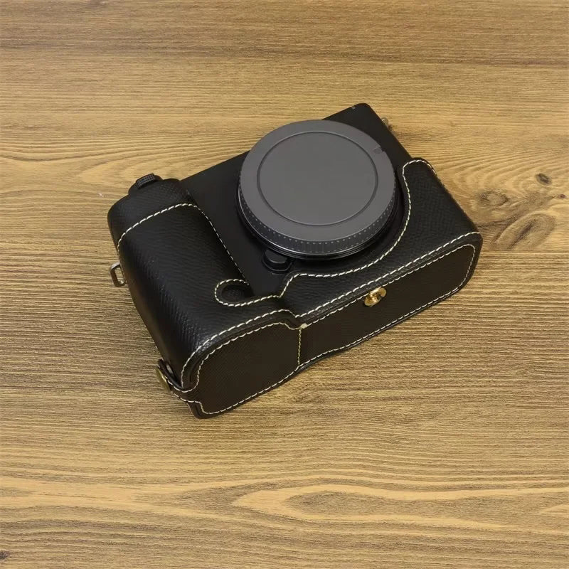 Uniqkart for Sony ZV-E1 Battery Opening Design PU Leather Camera Bottom Cover Half Body Case with Hand Strap - Black