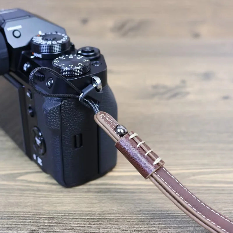 Uniqkart for Fuji / Canon / Nikon / Panasonic DSLR Camera 2mm Connector PU Leather Wrist Strap Hand Grip Rope - Brown