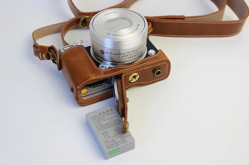 Protective PU Leather Camera Case Bag with Shoulder Strap for Nikon J5 (10-30mm) - Brown