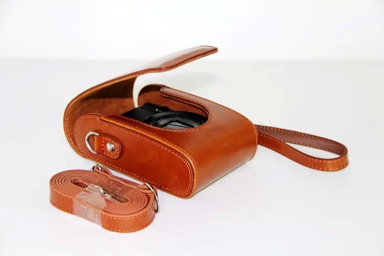 Universal PU Leather Camera Protective Pouch + Strap for Leica / Panasonic / Fuji / Canon, Size: 11x6.5x3.5cm  - Brown